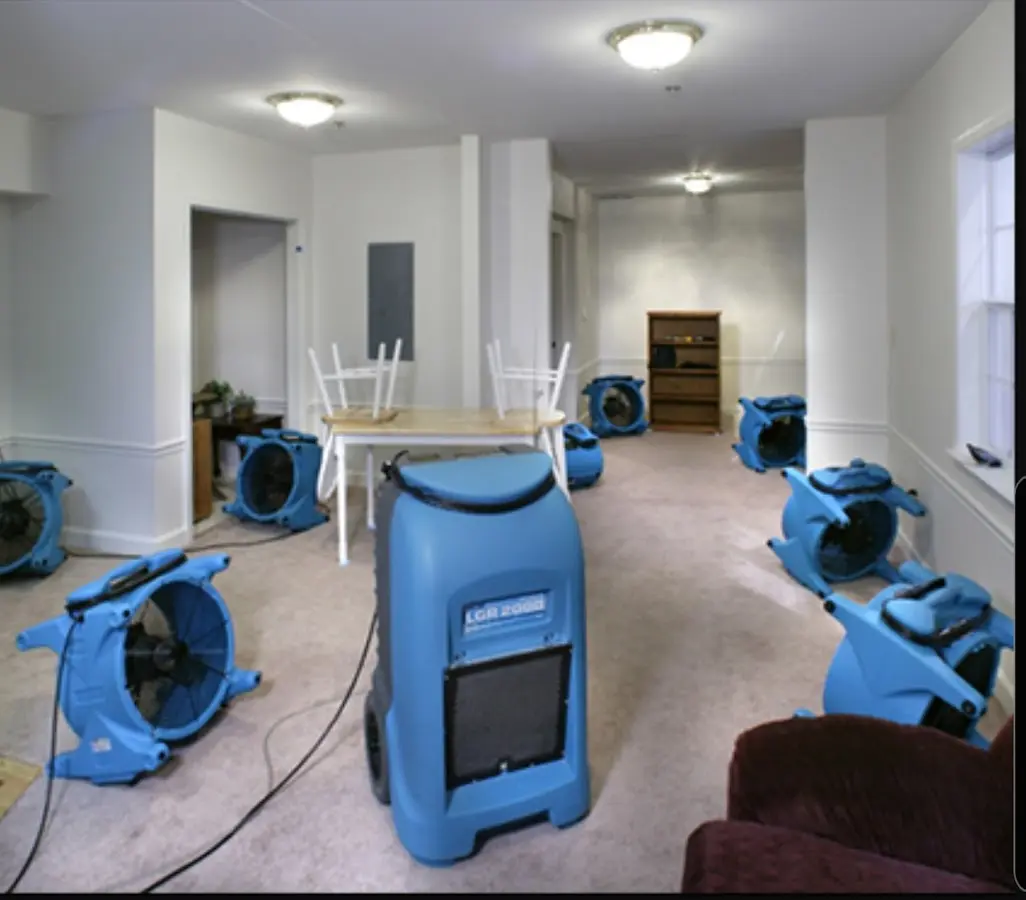 Air movers and dehumidifier setup for Water Damage Restoration in Rose